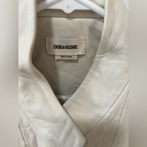 Brand new beautiful jacket.  A tinge too small for me. Never worn.